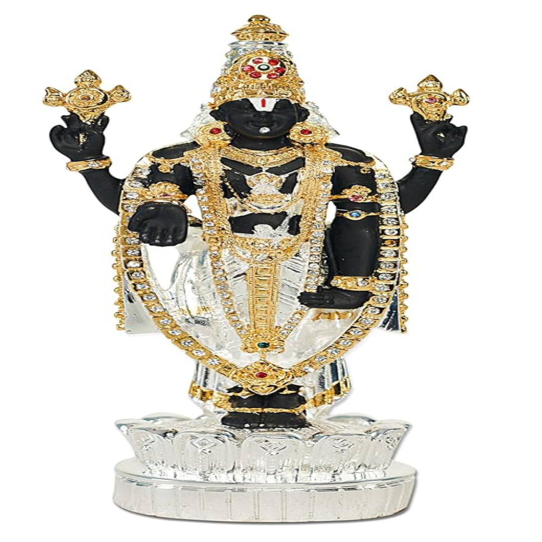 Decorative statue with intricate gold and black details on a white background