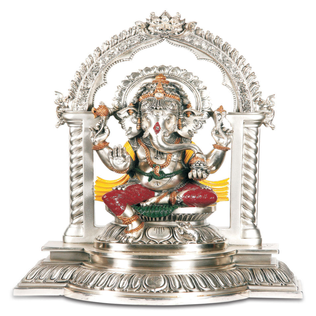 Decorative statue of a deity in a silver arch on a white background