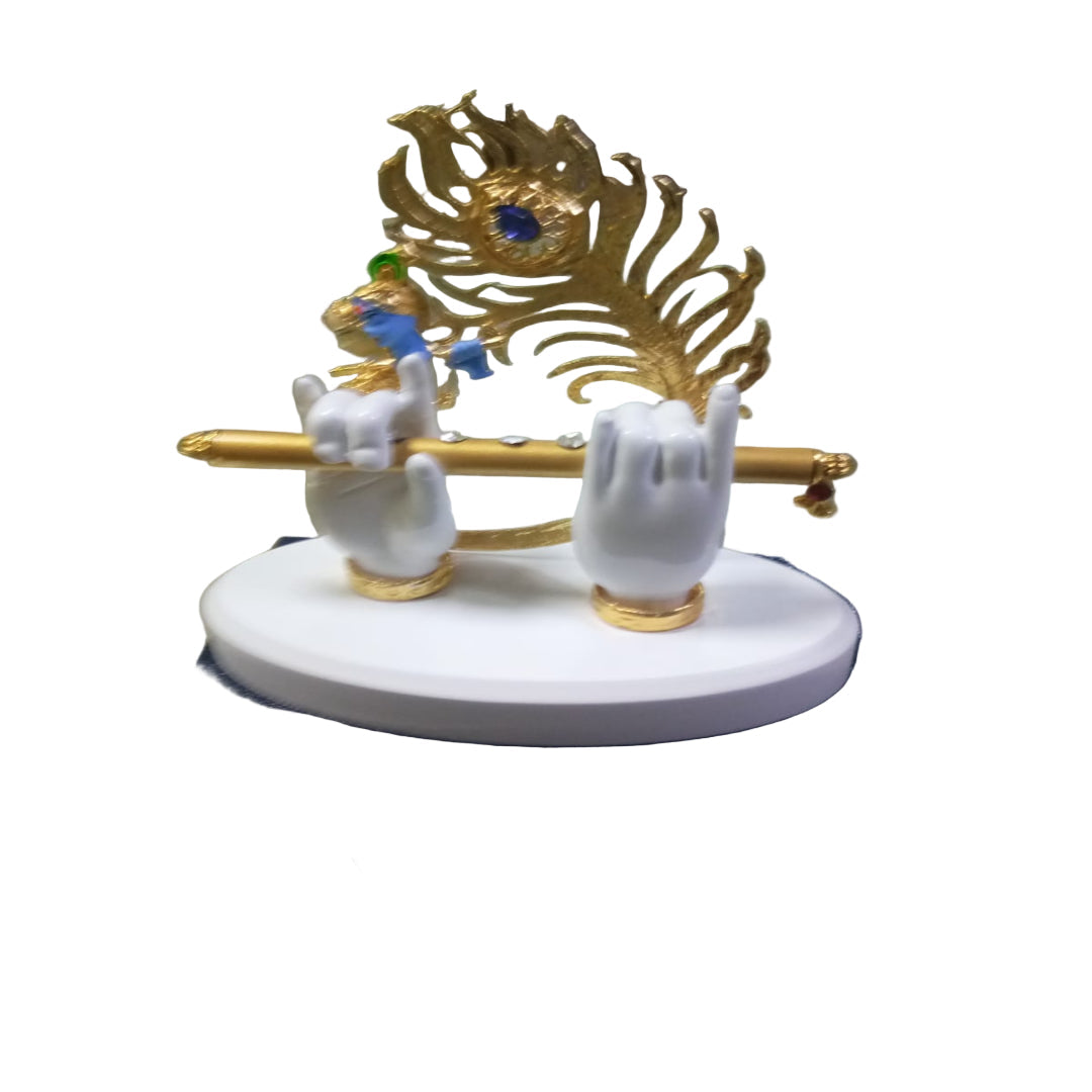 Decorative figurine of a peacock on a pedestal with white birds, on a blue box.