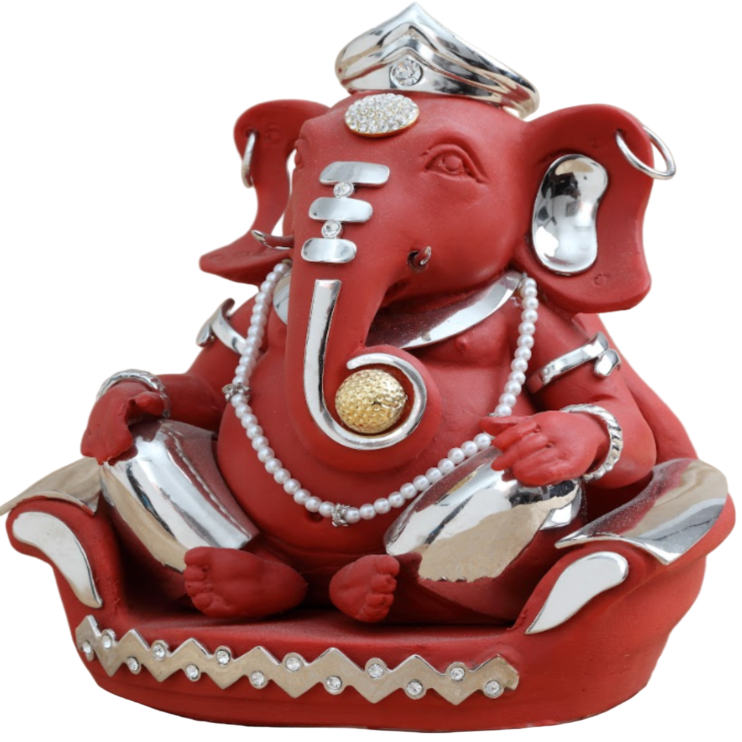 Decorative red elephant figurine with silver and gold accents on a beige background